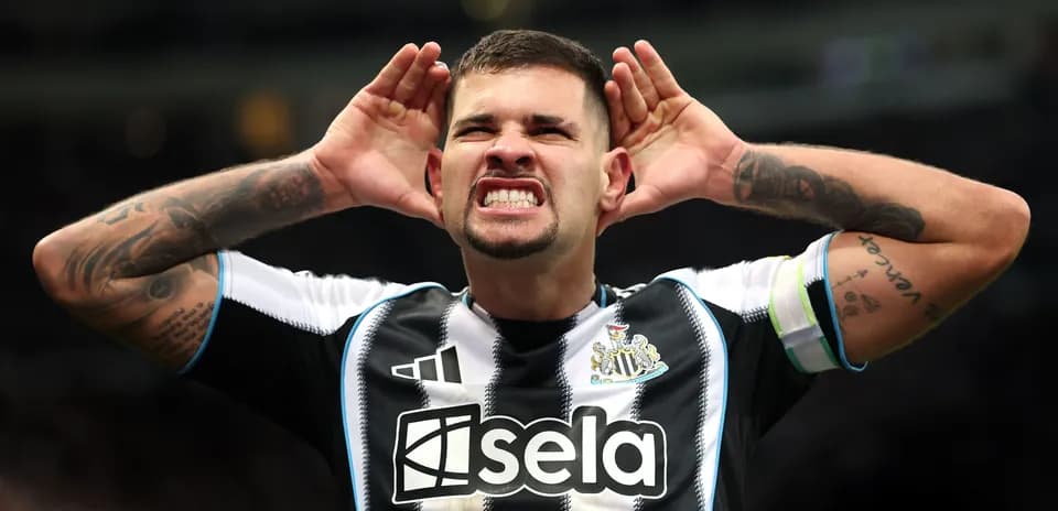 Player celebrating by cupping hands to ears