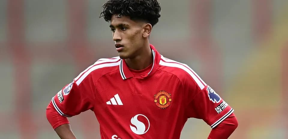 Player in red Manchester United kit on the field