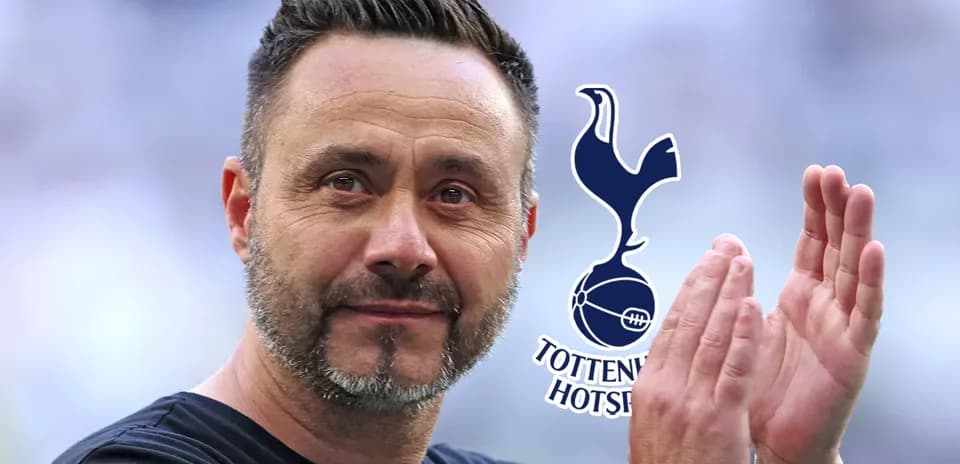 Coach applauding with Tottenham Hotspur logo in background