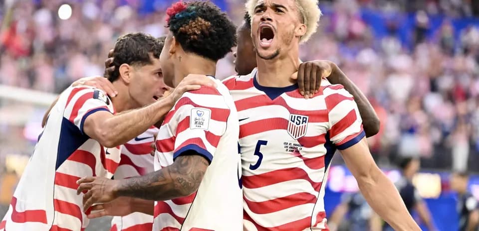 USA players celebrating a goal in World Cup match