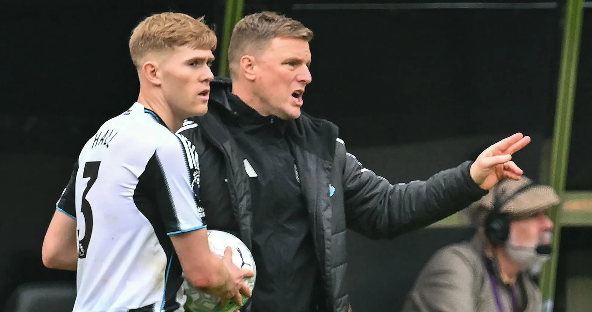Manager instructing player during a match