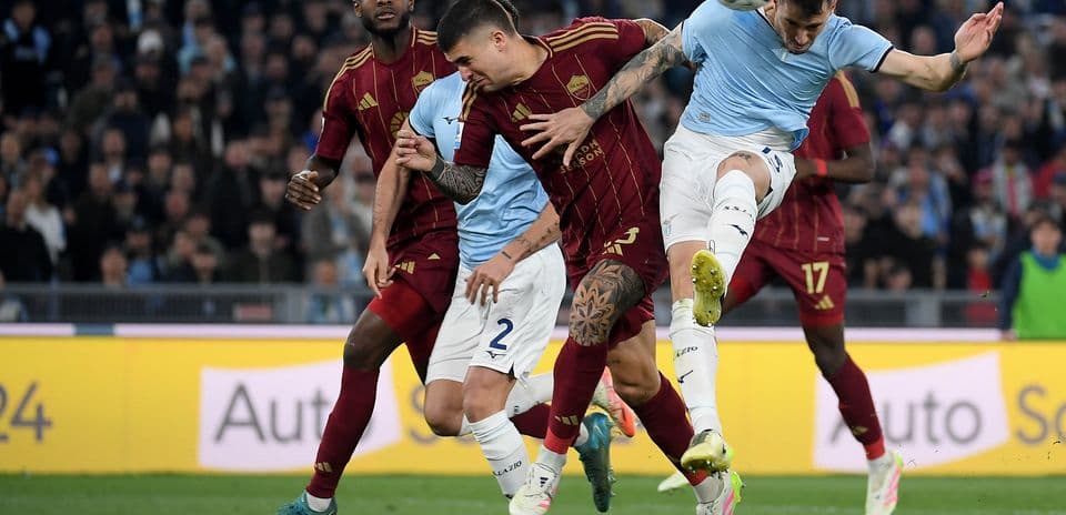 Players contesting for the ball in derby match