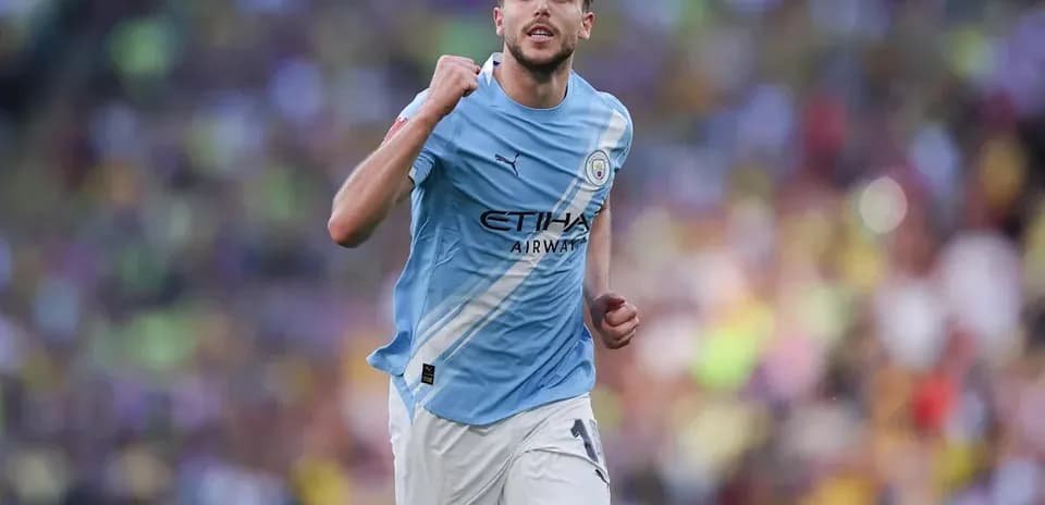 Player celebrating during match in light blue jersey