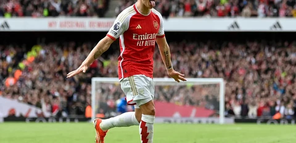 Player celebrating a goal at Emirates Stadium