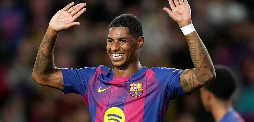 Player celebrating with hands raised on field
