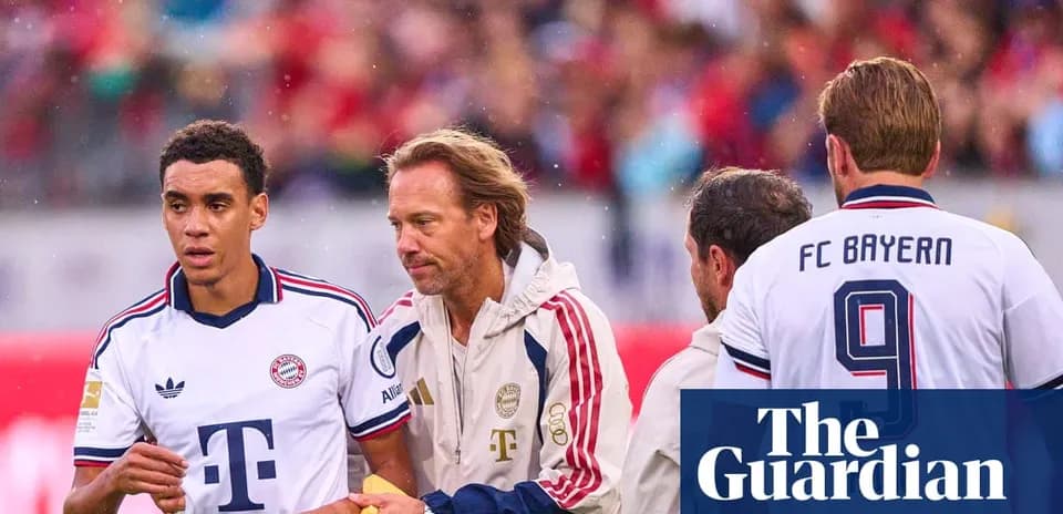 Bayern Munich players interacting on the sideline