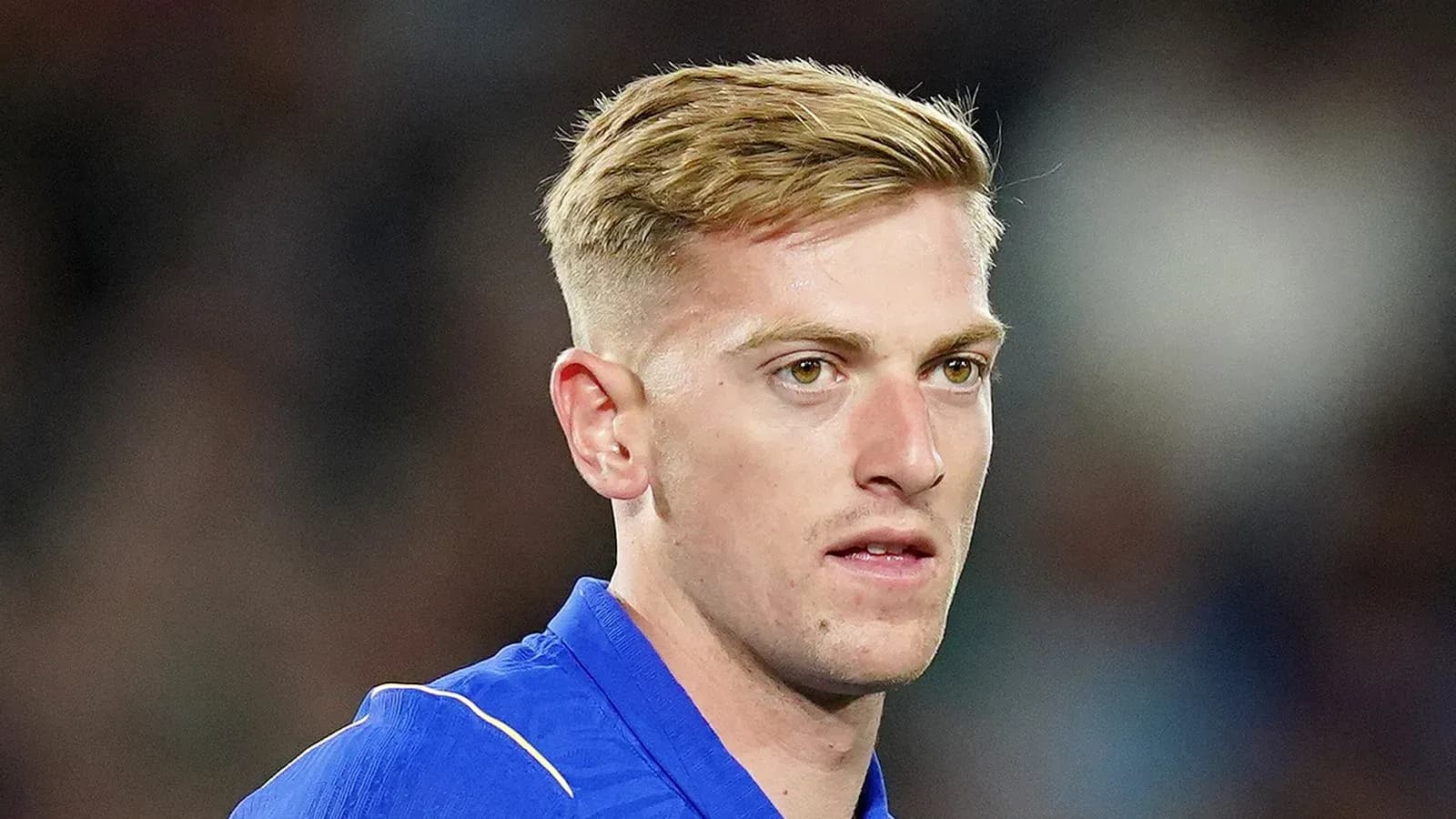 Football player in blue jersey during match