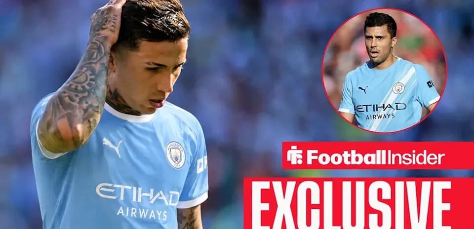 Player in Manchester City kit looking down on pitch