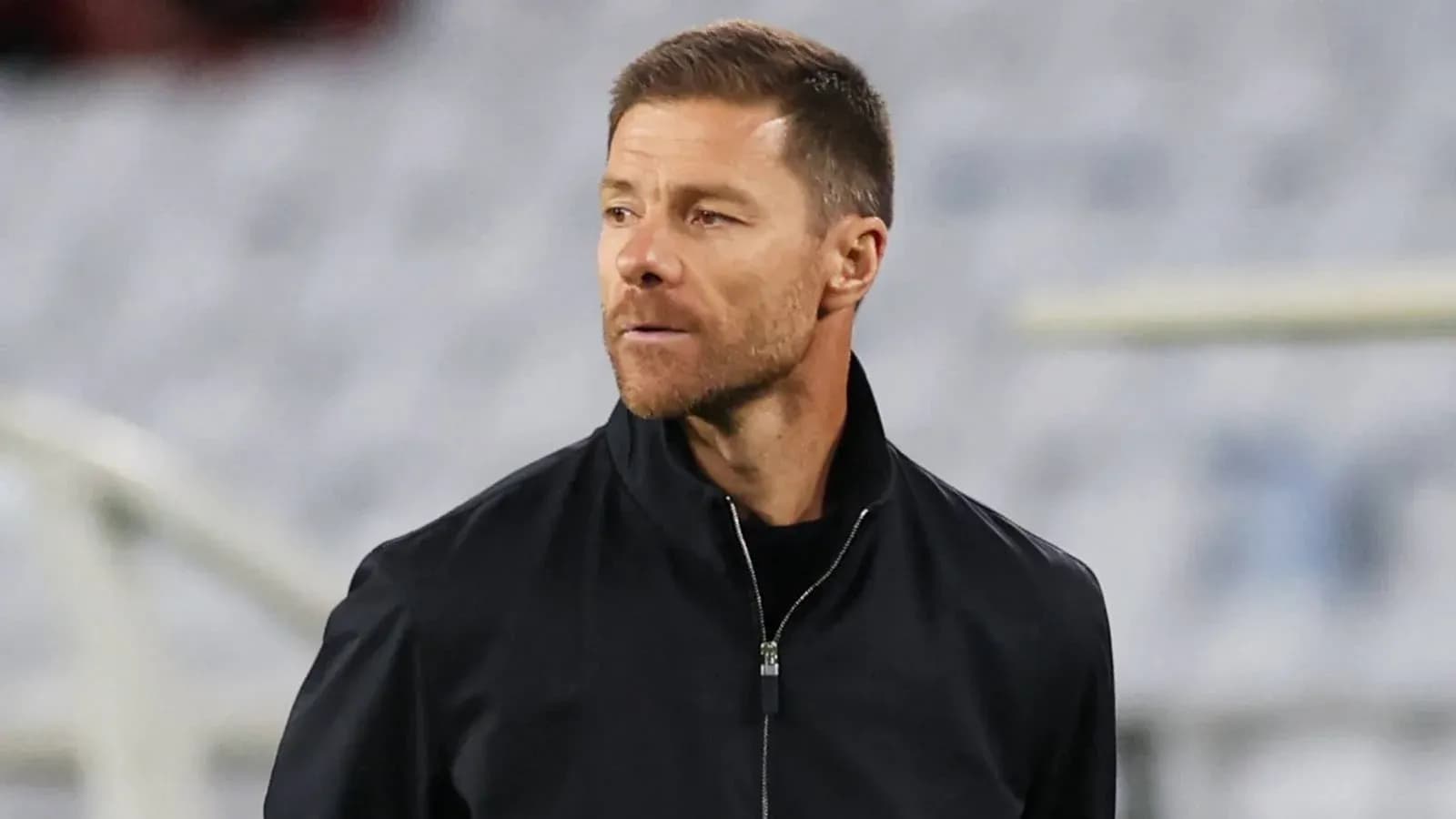 Coach observing the match from the sideline