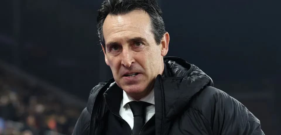 Coach in black jacket during match