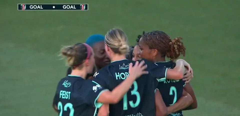 Players celebrating a goal during match