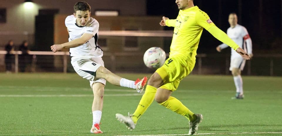 Player striking the ball during SC St. Tönis match