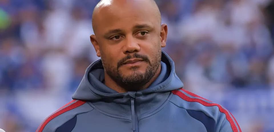 Coach wearing a team hoodie before the match