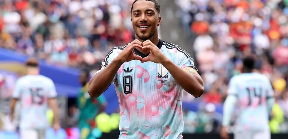 Player making heart gesture after scoring goal