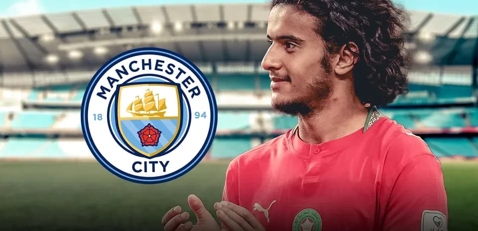 Player in Manchester City jersey with stadium background