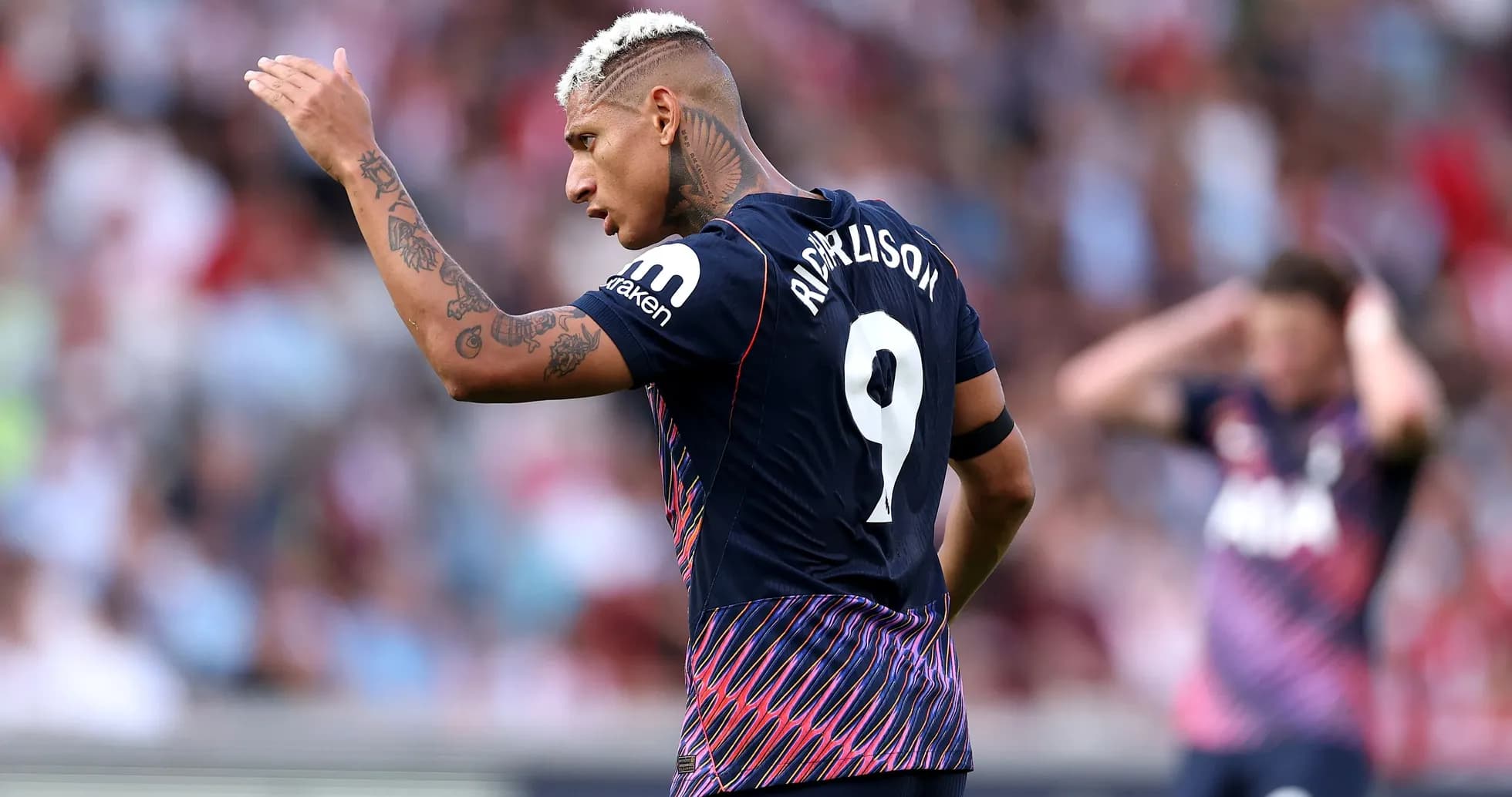 Richarlison gesturing during a match on the field