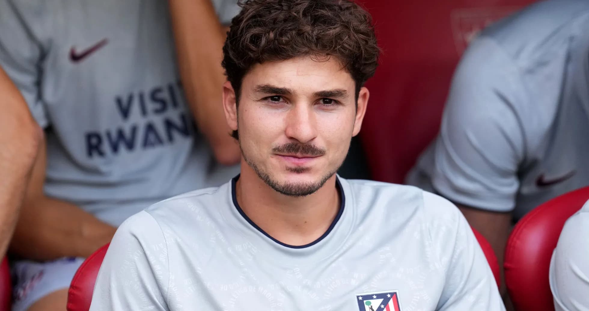 Player sitting on bench in team kit