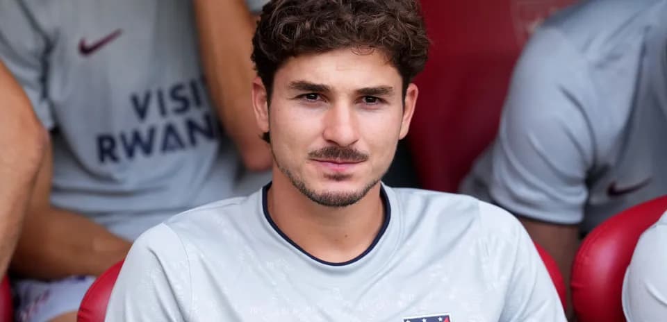Player sitting on bench in team kit