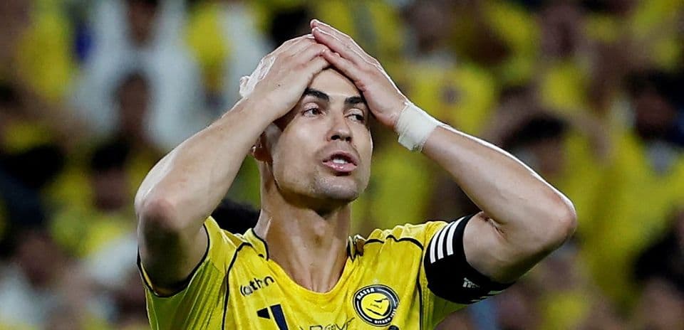 Player in yellow jersey showing frustration on field
