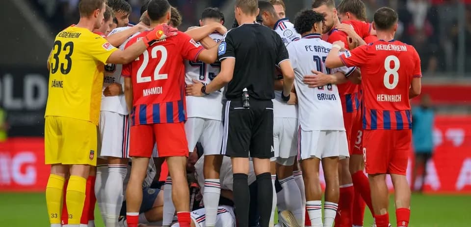 Players from both teams gathered during a stoppage