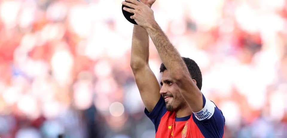 Player celebrating with trophy after match victory