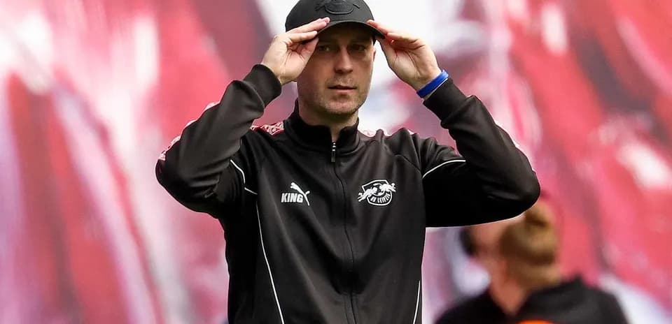 Coach adjusting cap during match on the sideline