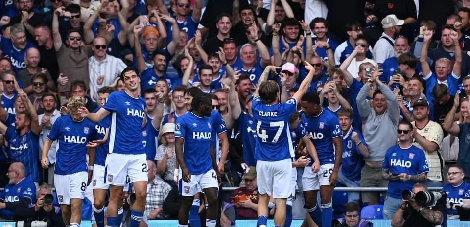 Ipswich players celebrating a goal with fans