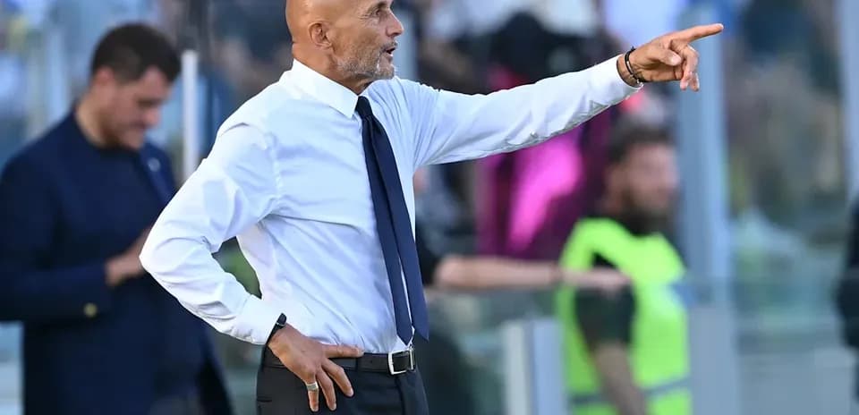 Coach gesturing from the sidelines during match