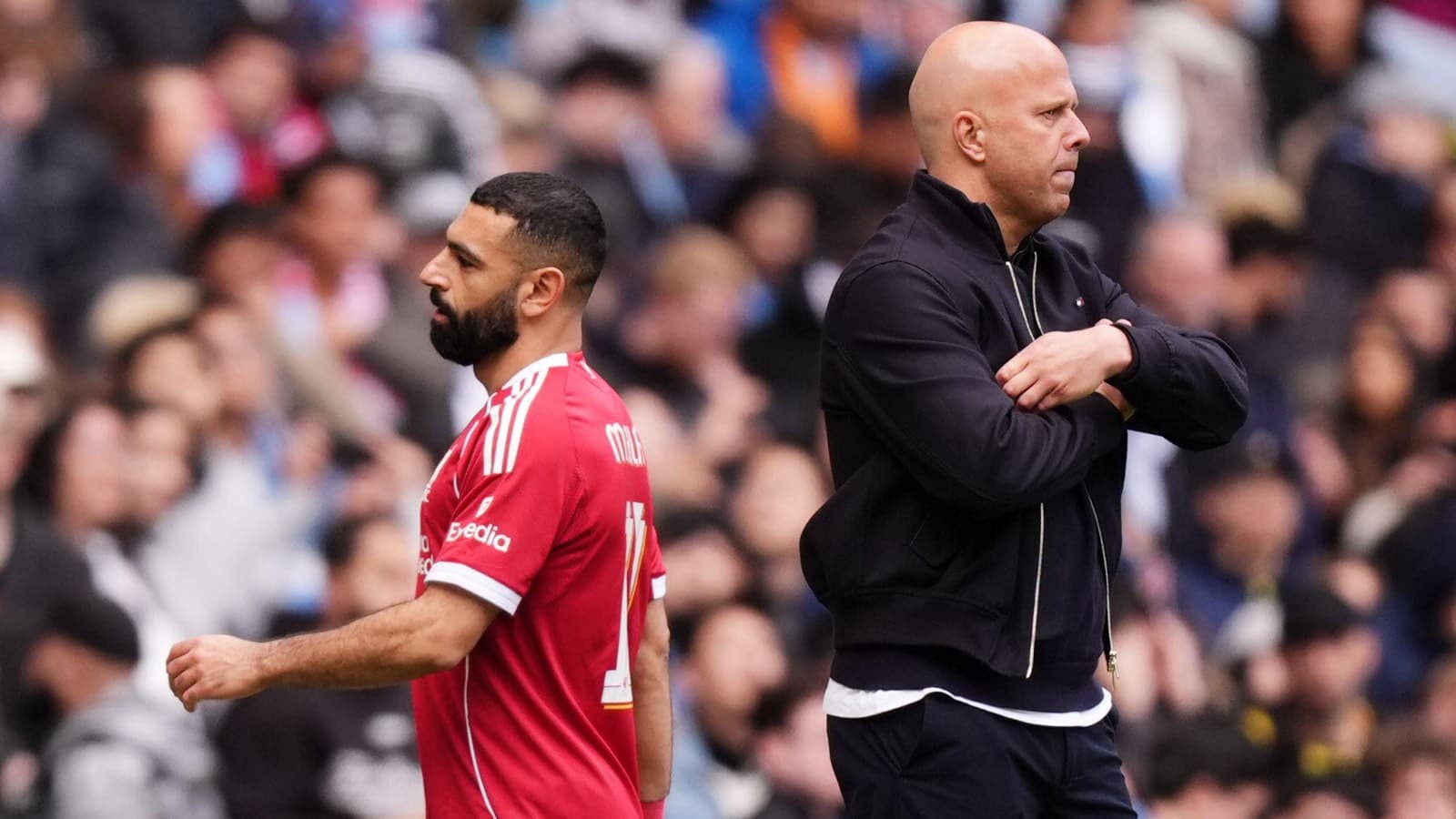 Player and coach on sideline during match