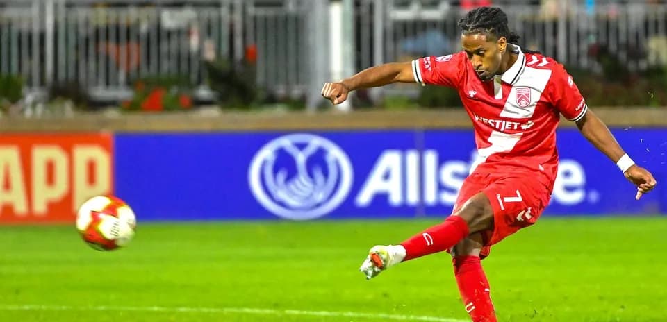 Player taking a shot during Cavalry FC match