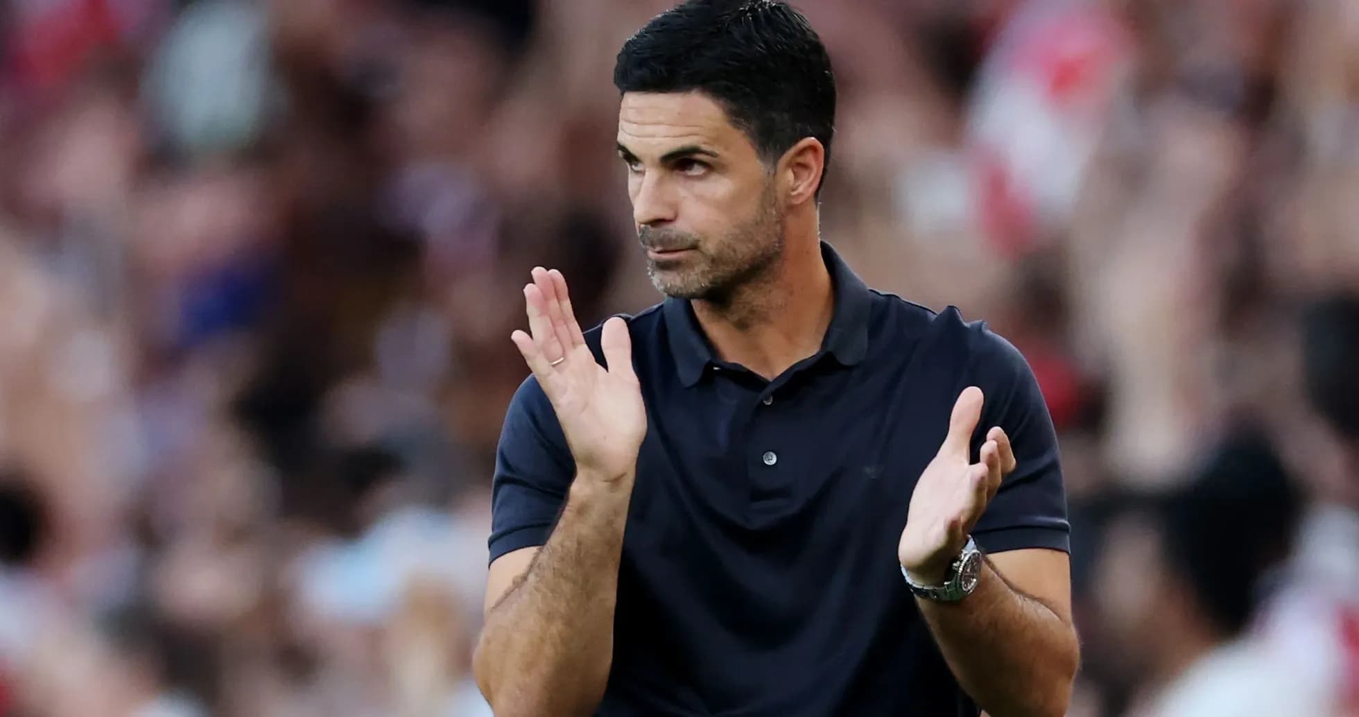 Coach applauding during a football match