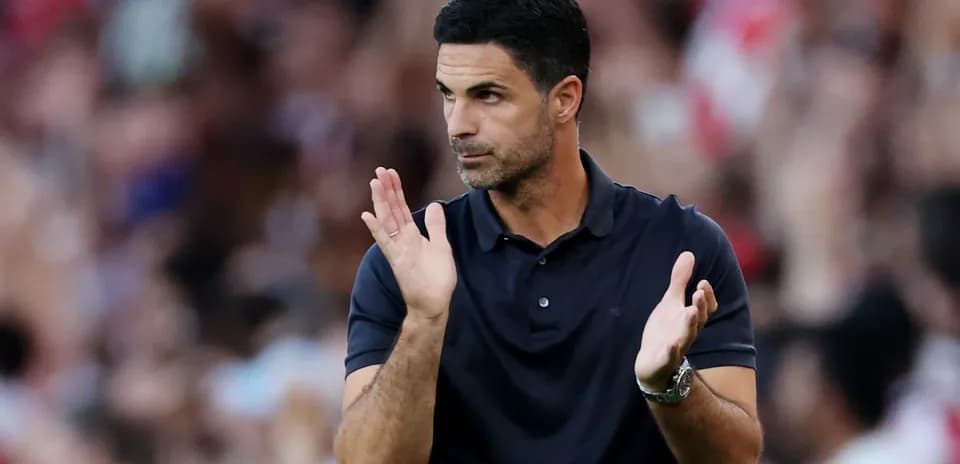 Coach applauding during a football match