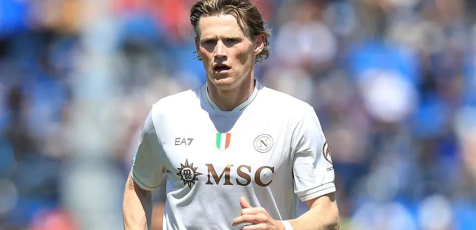 Player in Napoli kit running on the pitch