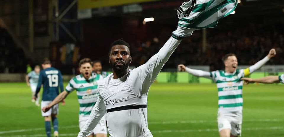 Player celebrating with shirt raised after scoring