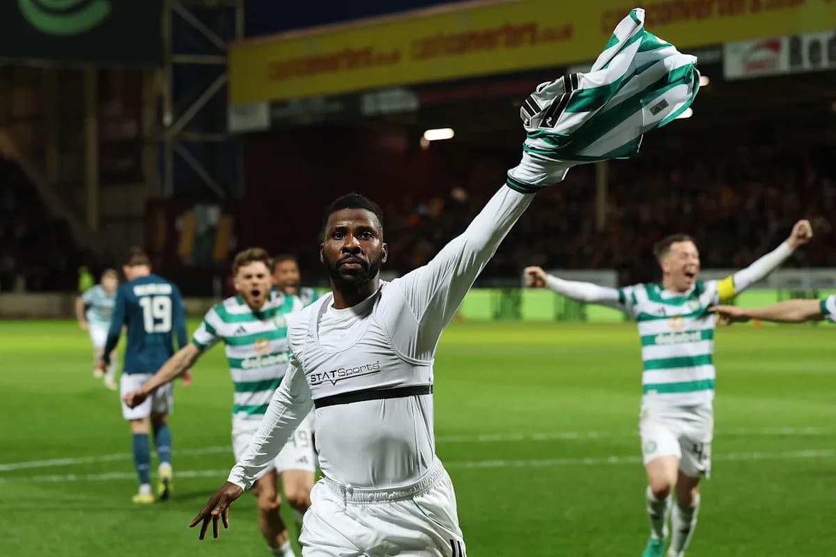 Player celebrating with shirt raised after scoring