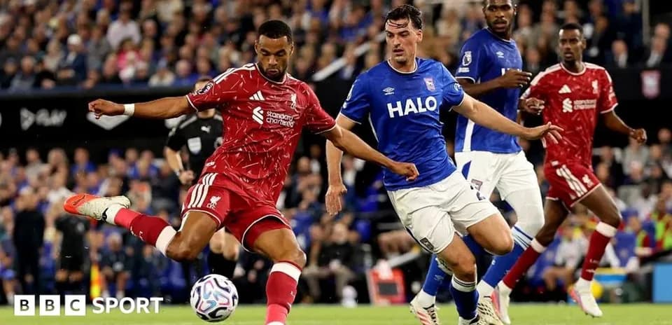 Liverpool player kicking the ball against Ipswich team