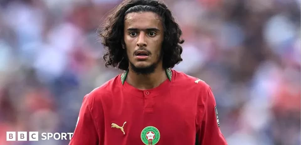 Moroccan player in red jersey on the field
