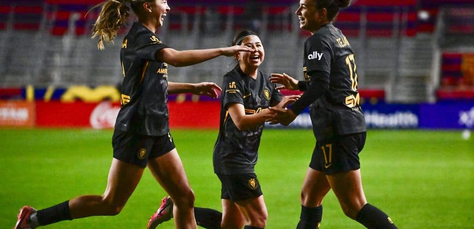 Players celebrating a goal during football match