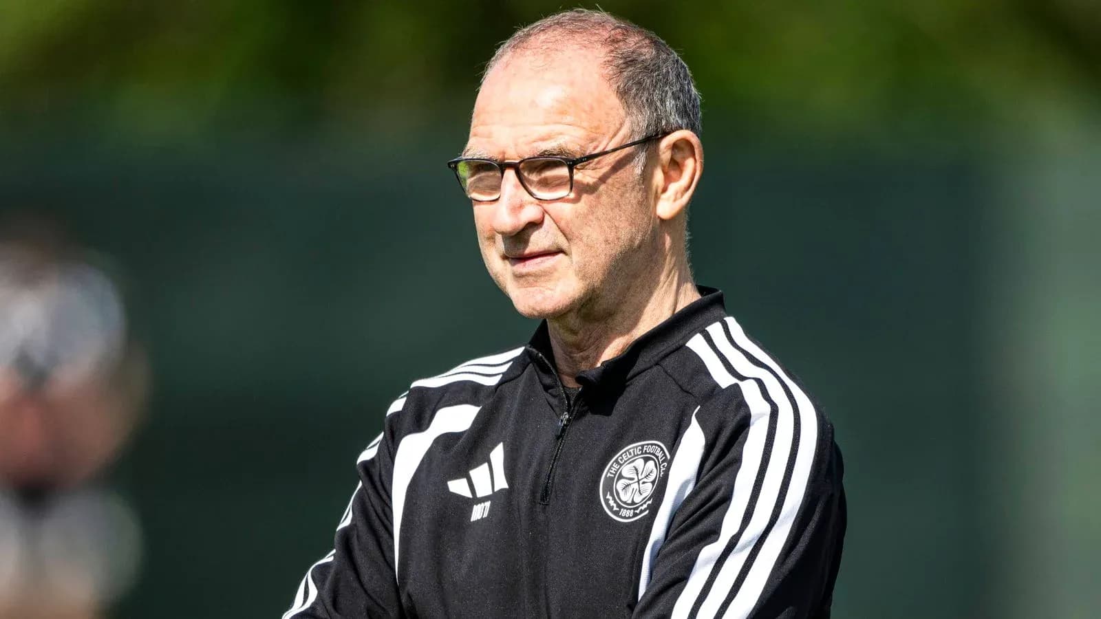 Manager observing training session at practice facility