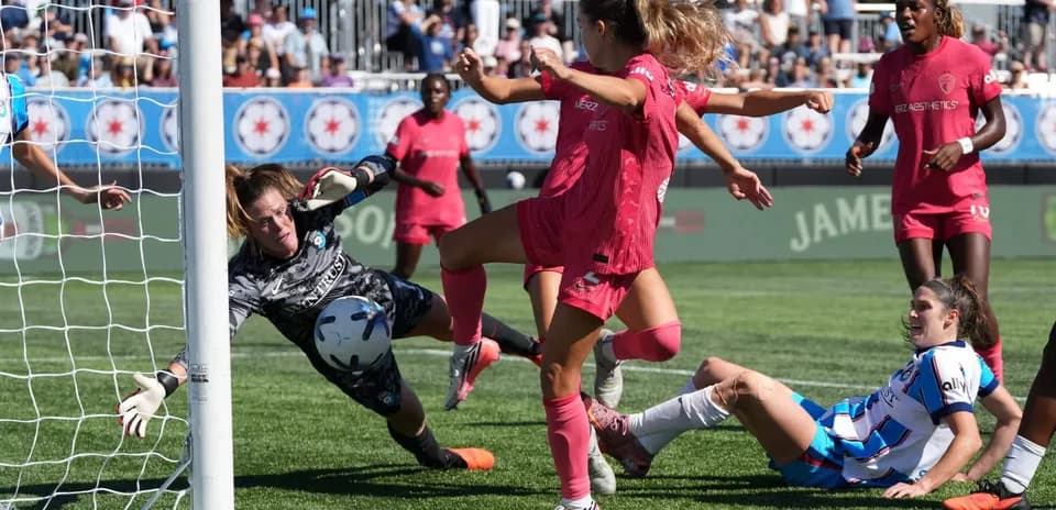 Goalkeeper saves shot during Red Stars vs Spirit match