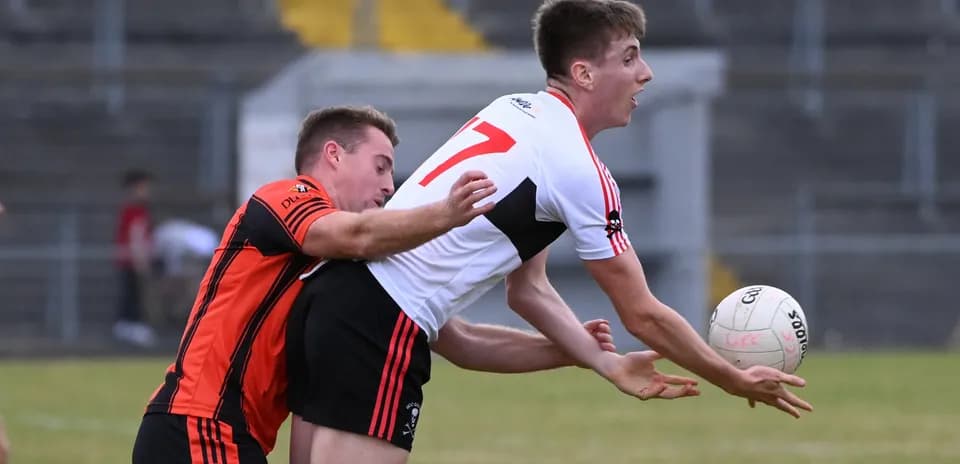 Two players contesting for the ball during match
