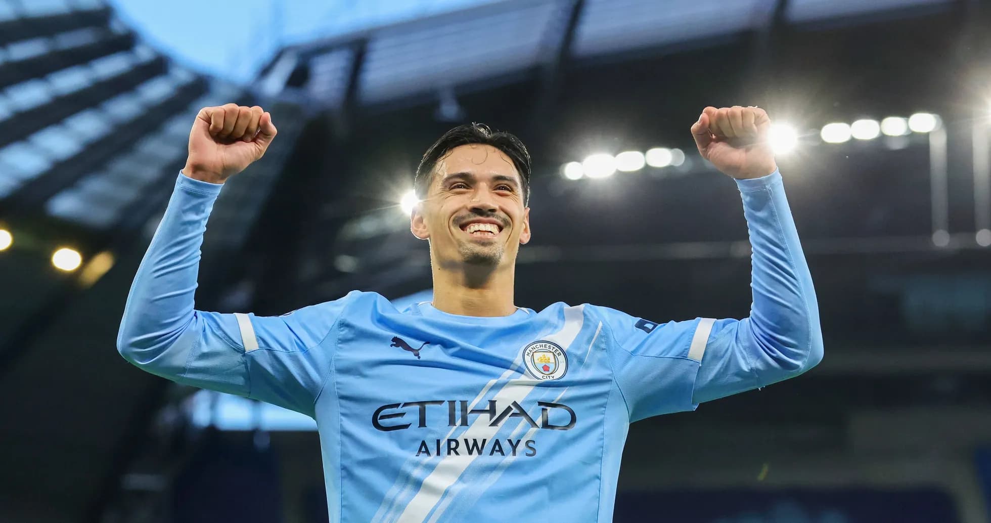 Player celebrating victory in Manchester City kit