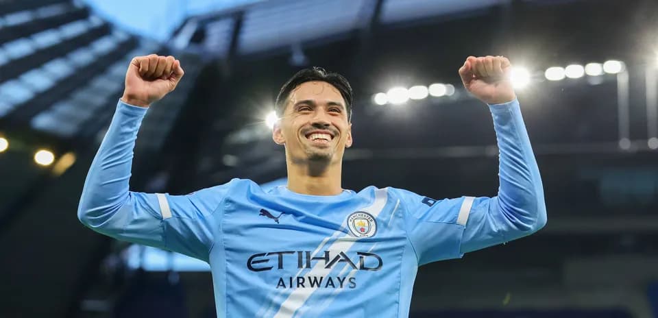 Player celebrating victory in Manchester City kit