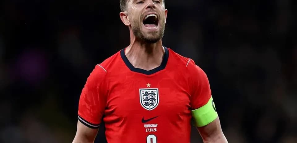 Player celebrating in England's red jersey during match