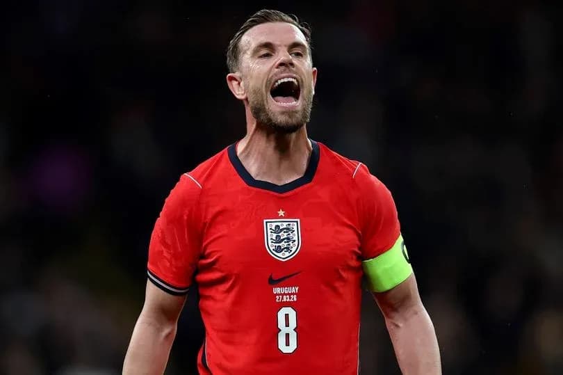 Player celebrating in England's red jersey during match