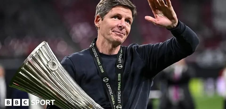 Coach celebrating with trophy after match victory
