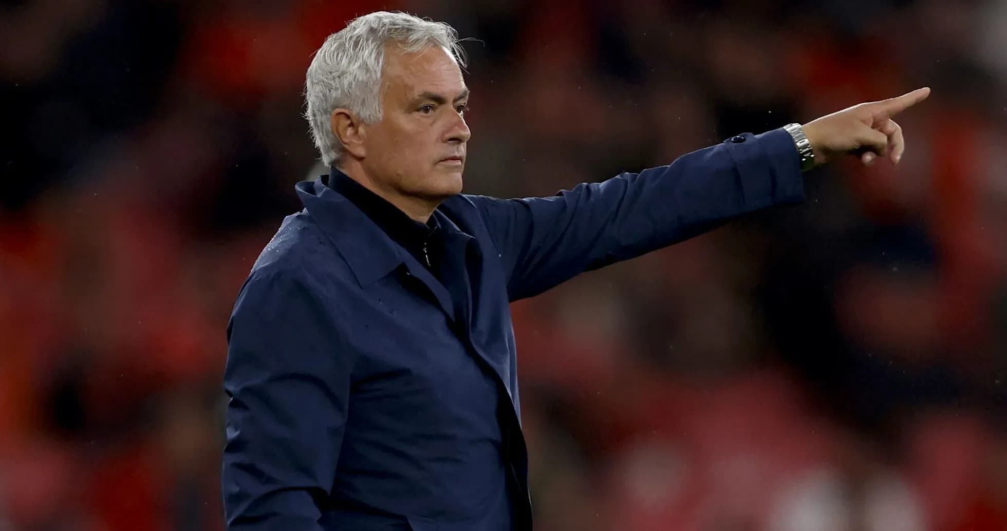 Manager directing players from the sidelines during match