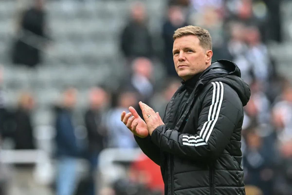 Manager applauding fans during a match