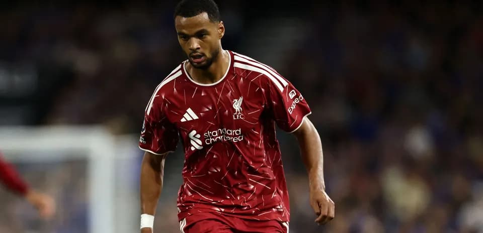 Player wearing Liverpool kit during match action