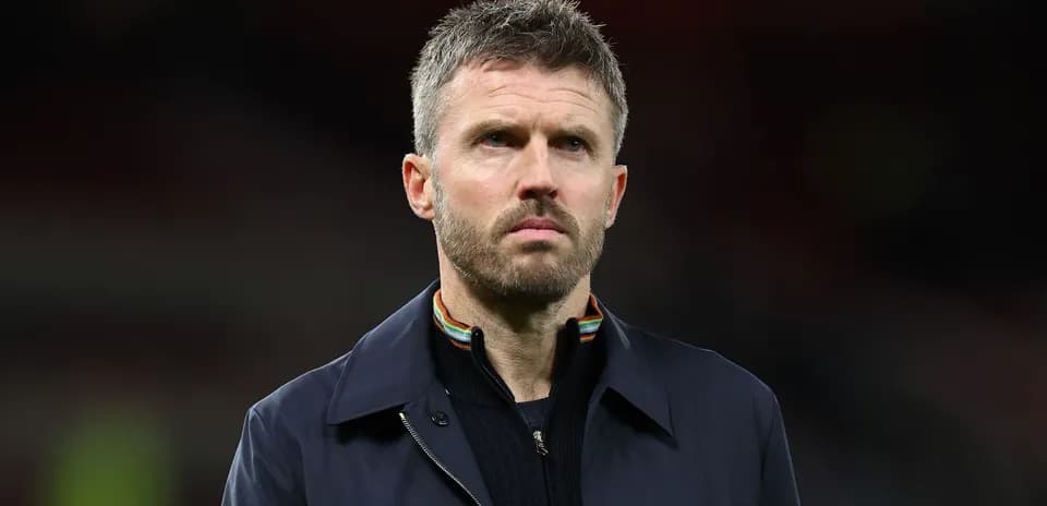 Man in a dark coat during a match